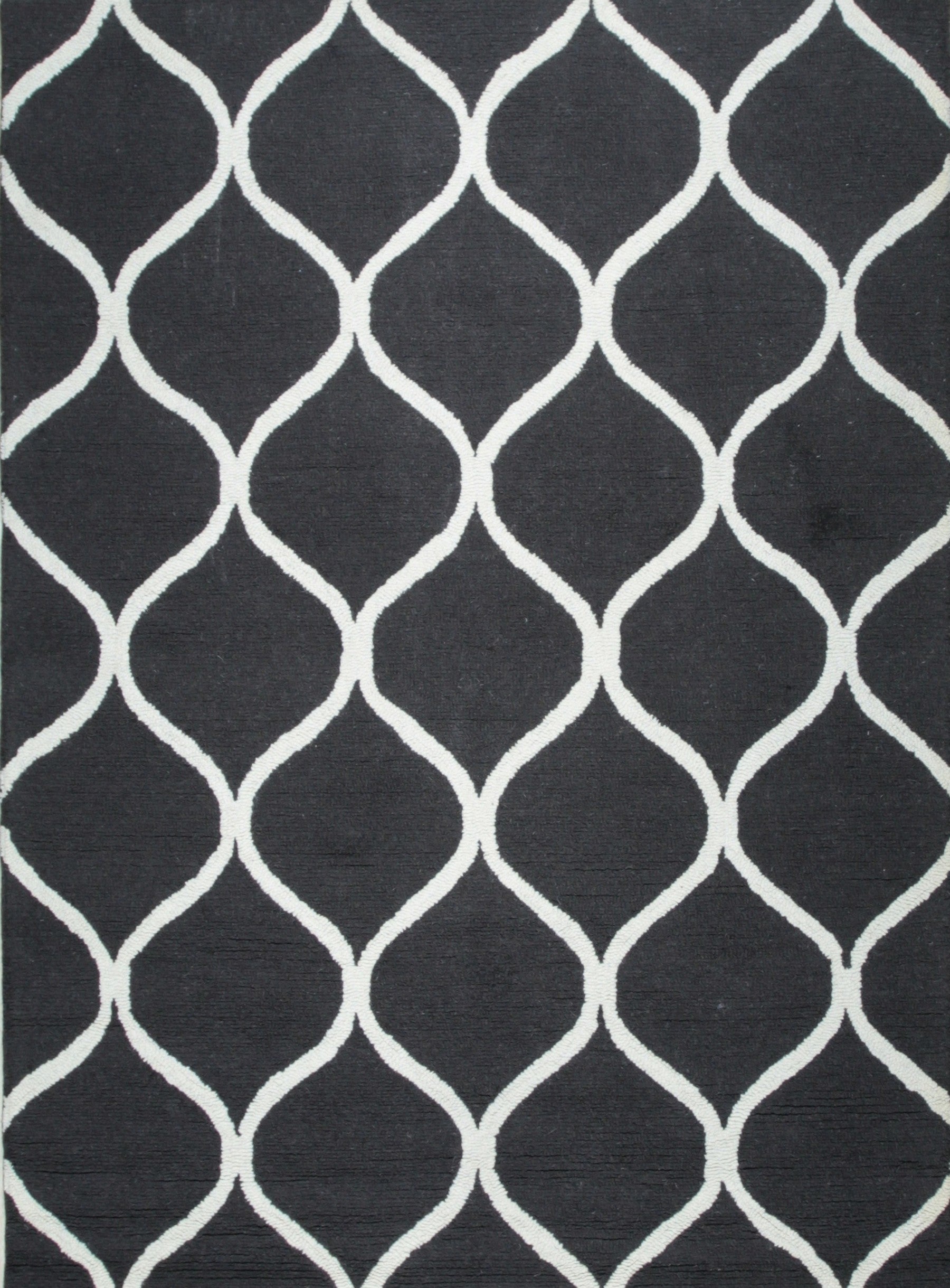 Isolated view of Sloane Willow Navy Hand Tufted Wool Rug, showcasing its willow-branch inspired design flowing across a deep navy field.