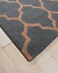 Ophelia Moroccan Midnight Hand Tufted Wool Rug, dark blues and creams coalesce in a plush, hand-tufted wool rug, its geometric Moroccan pattern grounding a modern living room setting.