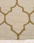 Ruby Trellis Light Beige Hand Tufted Wool Rug, light beige wool pile showcasing a repeating trellis pattern, seen in a bright interior setting.