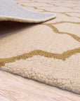 Ruby Trellis Light Beige Hand Tufted Wool Rug, displaying its intricate trellis pattern and soft light beige hue in a living room setting.
