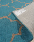 Sloane Moroccan Royal Blue Hand Tufted Wool Rug, vibrant royal blue wool rug featuring a geometric Moroccan-inspired design, showcased in a brightly lit living room setting.