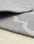 Trendy Moroccan Light Gray Hand Tufted Wool Rug, displaying intricate geometric patterns in soft light gray wool, filling a cozy living space.