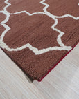 Trendy Moroccan Rust Hand Tufted Wool Rug, its rich rust hues and textured hand-tufted wool create a warm, inviting atmosphere in a modern living space.
