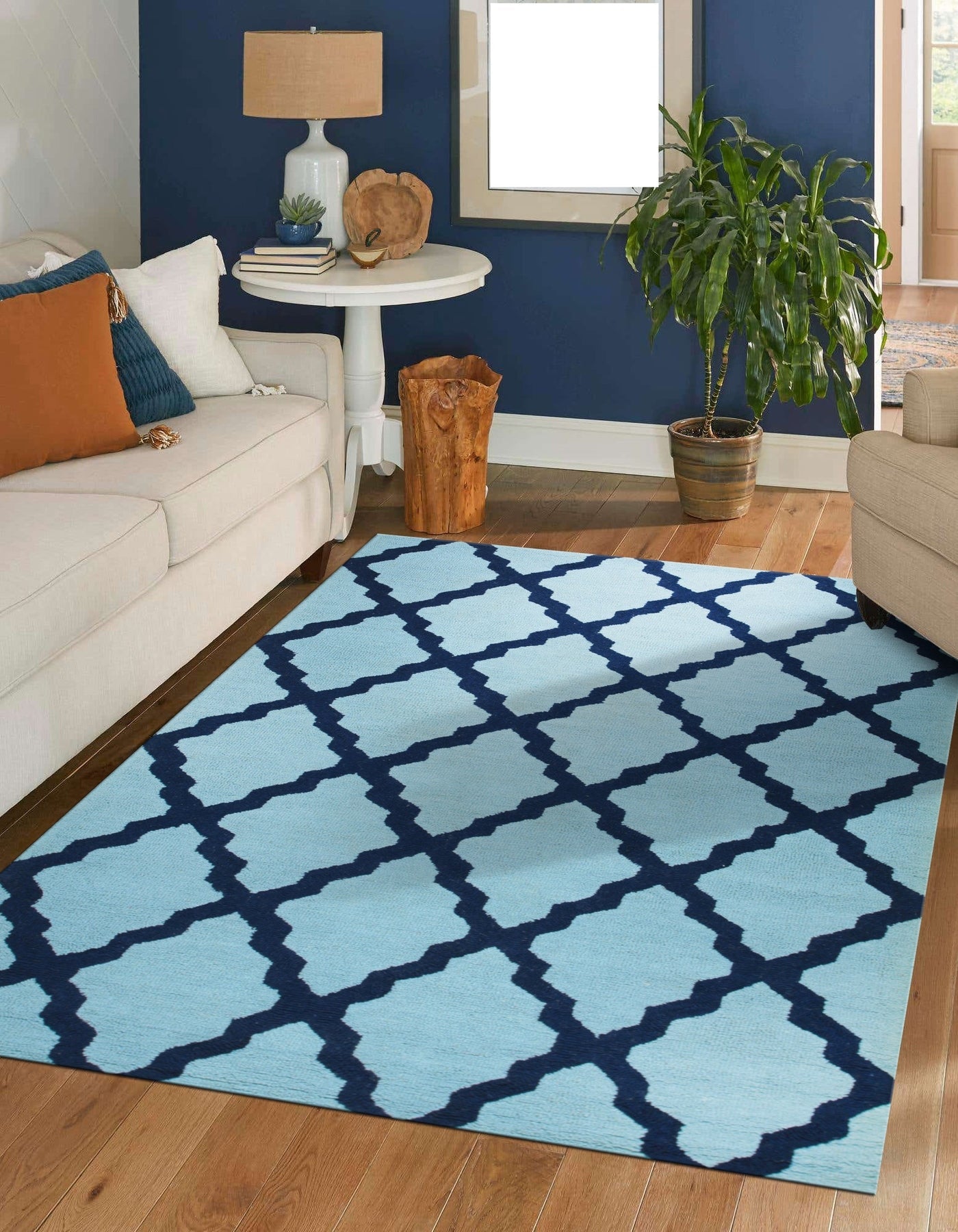 Bianca Trellis Sea Blue Hand Tufted Wool Rug, its sea blue hues and hand-tufted texture enriching a softly lit living space with a subtle trellis pattern.