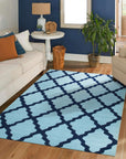 Bianca Trellis Sea Blue Hand Tufted Wool Rug, its sea blue hues and hand-tufted texture enriching a softly lit living space with a subtle trellis pattern.