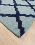 Bianca Trellis Sea Blue Hand Tufted Wool Rug, a soft sea blue wool rug featuring a classic trellis pattern, laid on a light wood floor creating a soothing and inviting atmosphere.