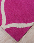 Willow Ella Pink Hand Tufted Wool Rug, soft pink and ivory tones blend in a hand-tufted wool rug with a subtle floral design, softening a modern living space.