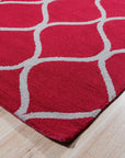 Delicate Enchanting Red Hand Tufted Wool Rug, showcasing its rich red hue and hand-tufted texture, displayed in a styled interior setting.