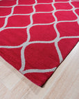 Delicate Enchanting Red Hand Tufted Wool Rug, showcasing its rich red hues and hand-tufted texture, displayed in a lifestyle setting with complementary furniture.