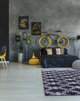 Penelope Moroccan Blue Hand Tufted Wool Rug, its intricate geometric patterns in shades of blue and cream adding warmth to a bright living space, crafted from soft hand-tufted wool.