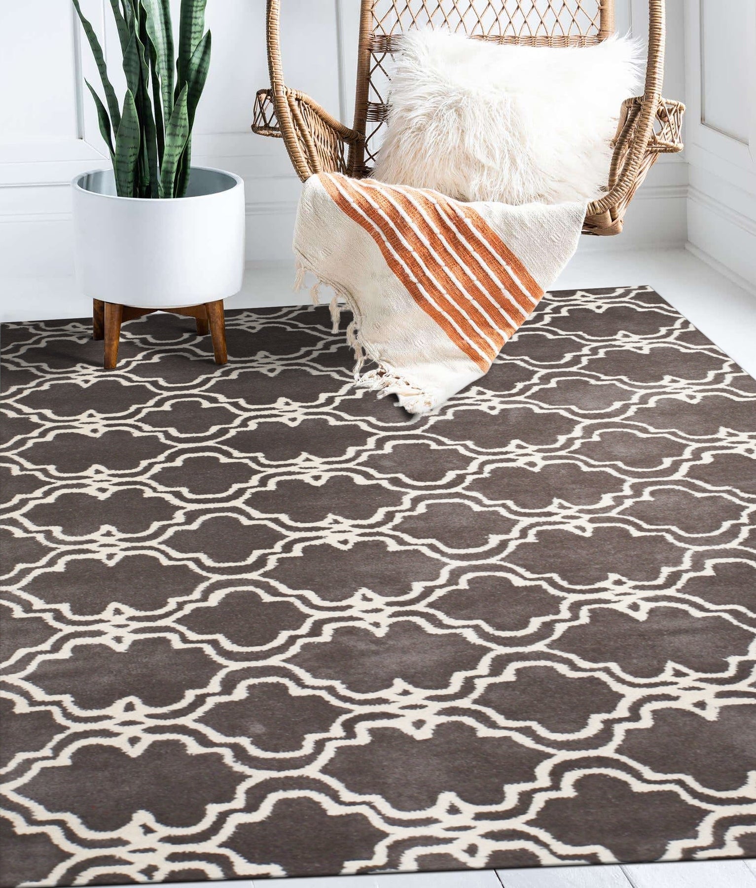 Refined Moroccan Gray Hand Tufted Wool Rug gracing a living room space, its soft gray hues and hand-tufted texture complementing a modern, minimalist interior.