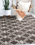 Refined Moroccan Gray Hand Tufted Wool Rug gracing a living room space, its soft gray hues and hand-tufted texture complementing a modern, minimalist interior.