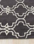 Refined Moroccan Gray Hand Tufted Wool Rug, soft gray tones and textured design anchoring a contemporary living room with sleek furniture and warm lighting.