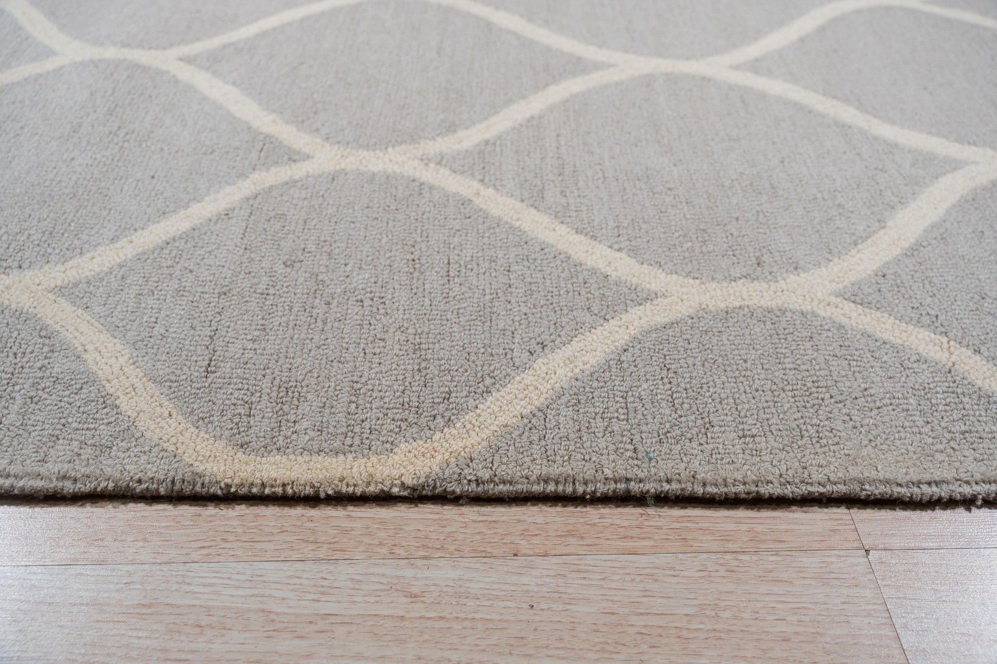 Classic Cozy Light Brown Hand Tufted Wool Rug, seen in a bright, neutral living room setting. Soft, warm brown wool pile invites comfort and elegance.