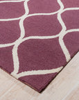 Ava Exquisite Burgundy Hand Tufted Wool Rug, showcasing rich burgundy hues and intricate hand-tufted detailing, lending luxurious warmth and texture to a room setting.