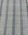 Luxurious Timeless Gray Handmade Wool Rug, woven with a subtle texture in a versatile gray, softly grounds a warmly lit living space.