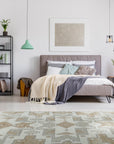 Inviting Oushak Ivory Hand Knotted Wool Rug, soft ivory wool texture and subtle floral patterns visible in a detailed close-up showcasing its hand-knotted construction.