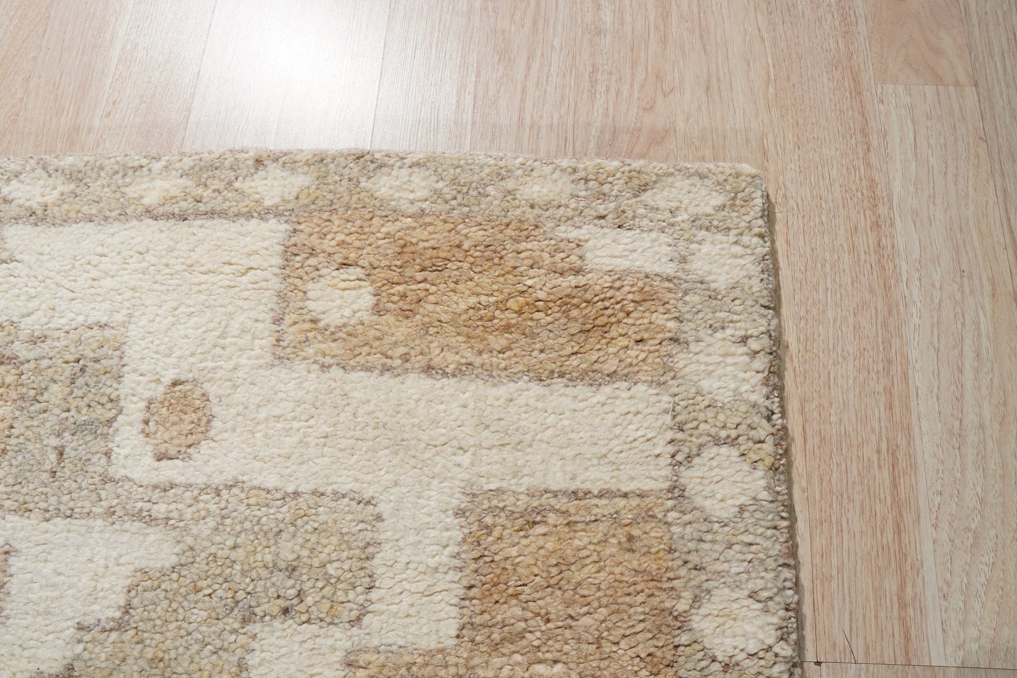 Inviting Oushak Ivory Hand Knotted Wool Rug, a warm ivory wool rug with a traditional Oushak design, showcased in a bright living space.