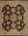 Isolated view of Chic Agra Brown Hand Knotted Wool Rug, showcasing its intricate floral and geometric design in warm browns and creams.