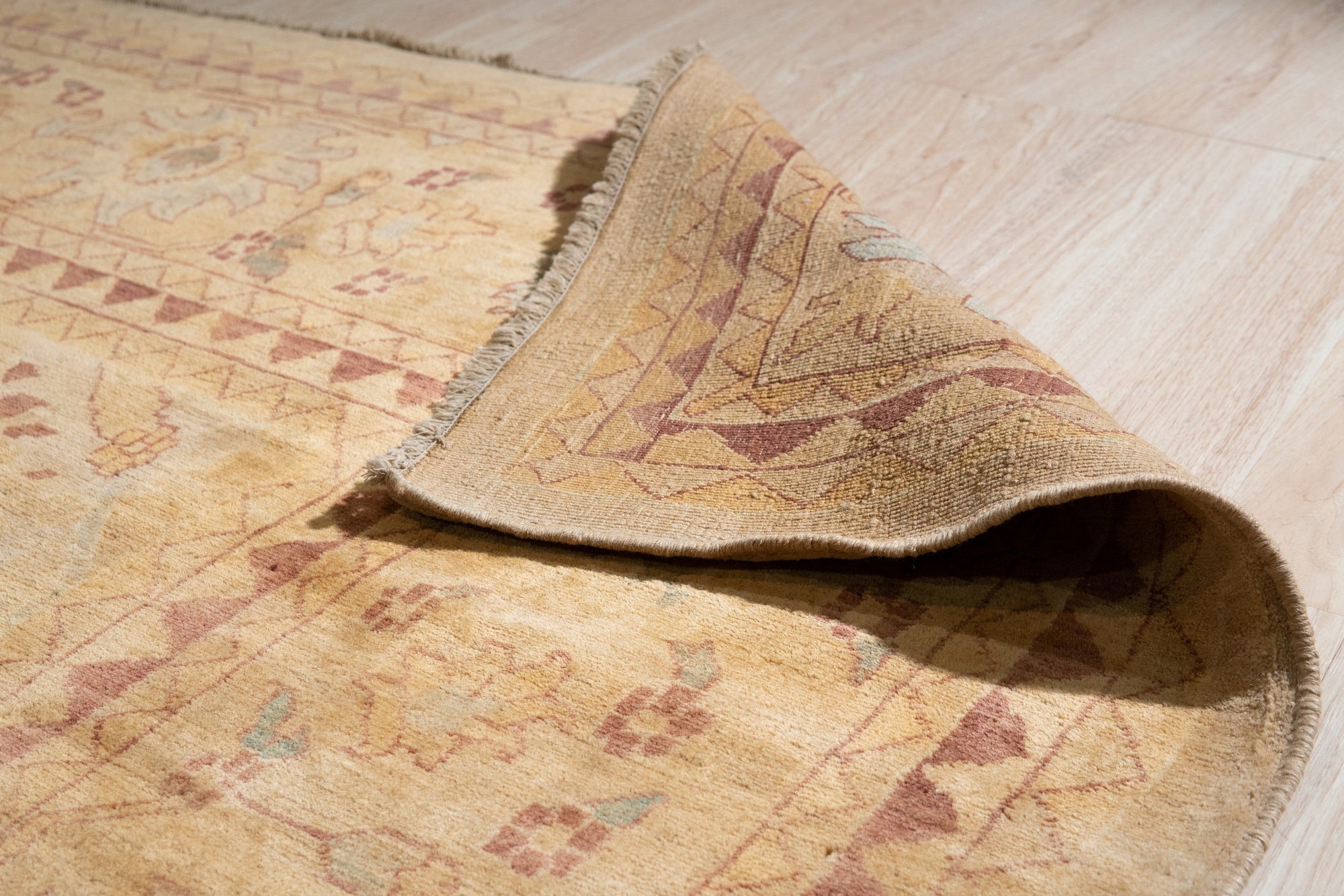 Violet Elegant Beige Hand Knotted Wool Rug, warm beige tones and subtle violet accents blend in a hand-knotted wool rug, creating an elegant and inviting texture underfoot.
