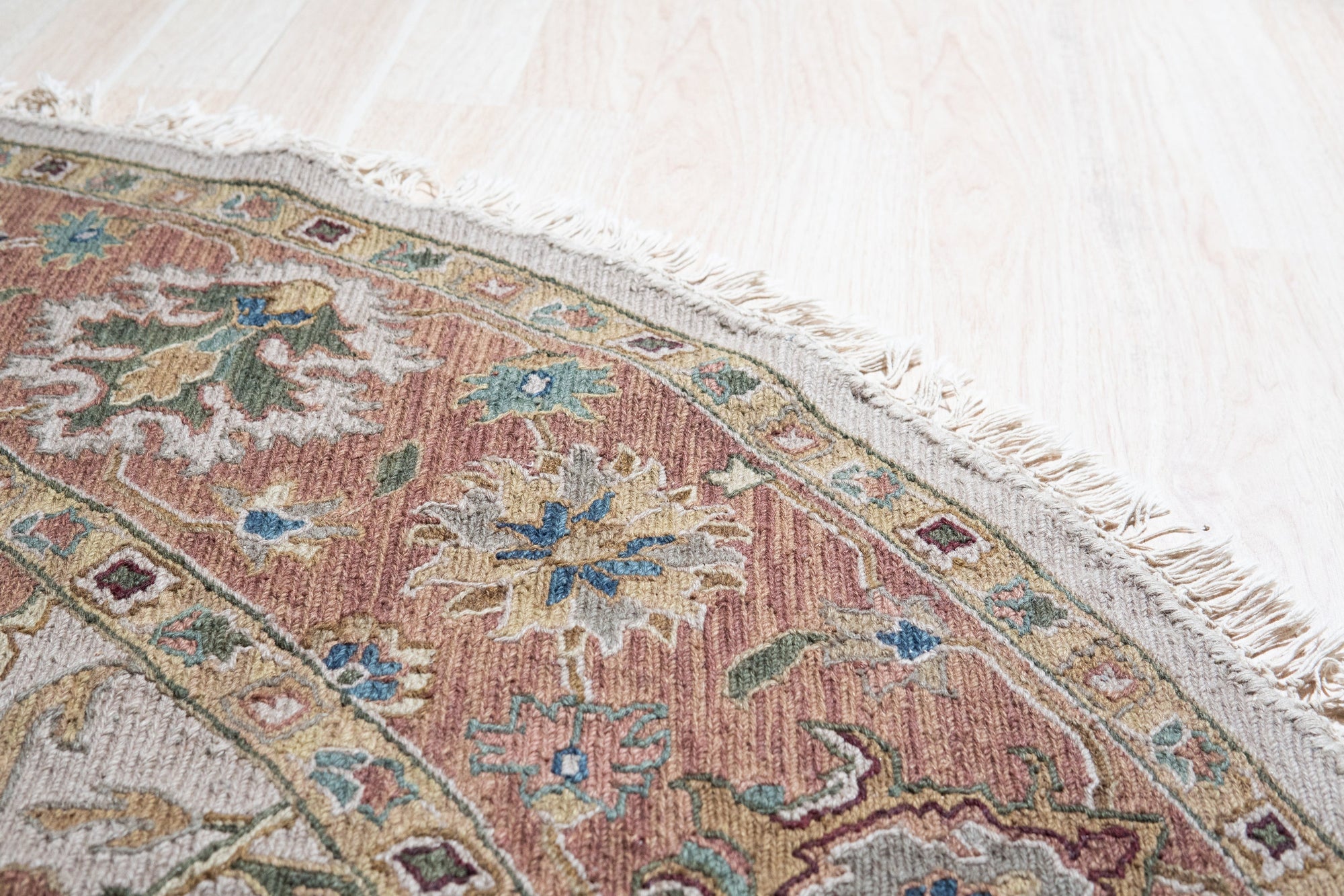 Comfortable Timeless Ivory Hand Knotted Wool Rug gracing a living room; soft textures and subtle ivory tones blend seamlessly with neutral furniture, illustrating a warm, inviting space.