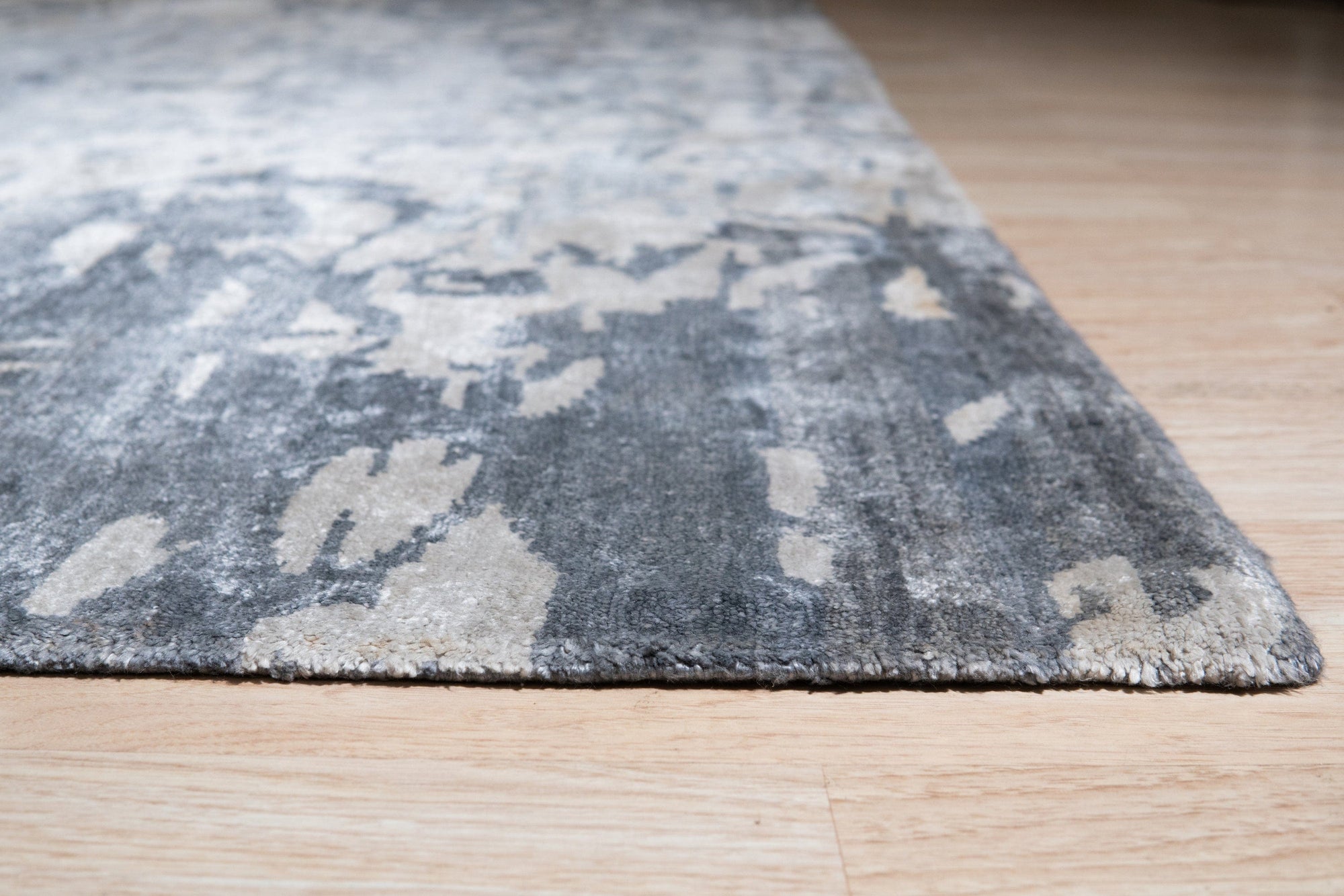 Amara Rhea Ivory Hand Knotted Rug, showcasing a plush, neutral foundation with a subtle, intricate pattern.