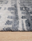 Graceful Classic Gray Hand Knotted Wool & Viscose Rug, a gray rug with a classic design, displayed in a living room setting with neutral furniture.