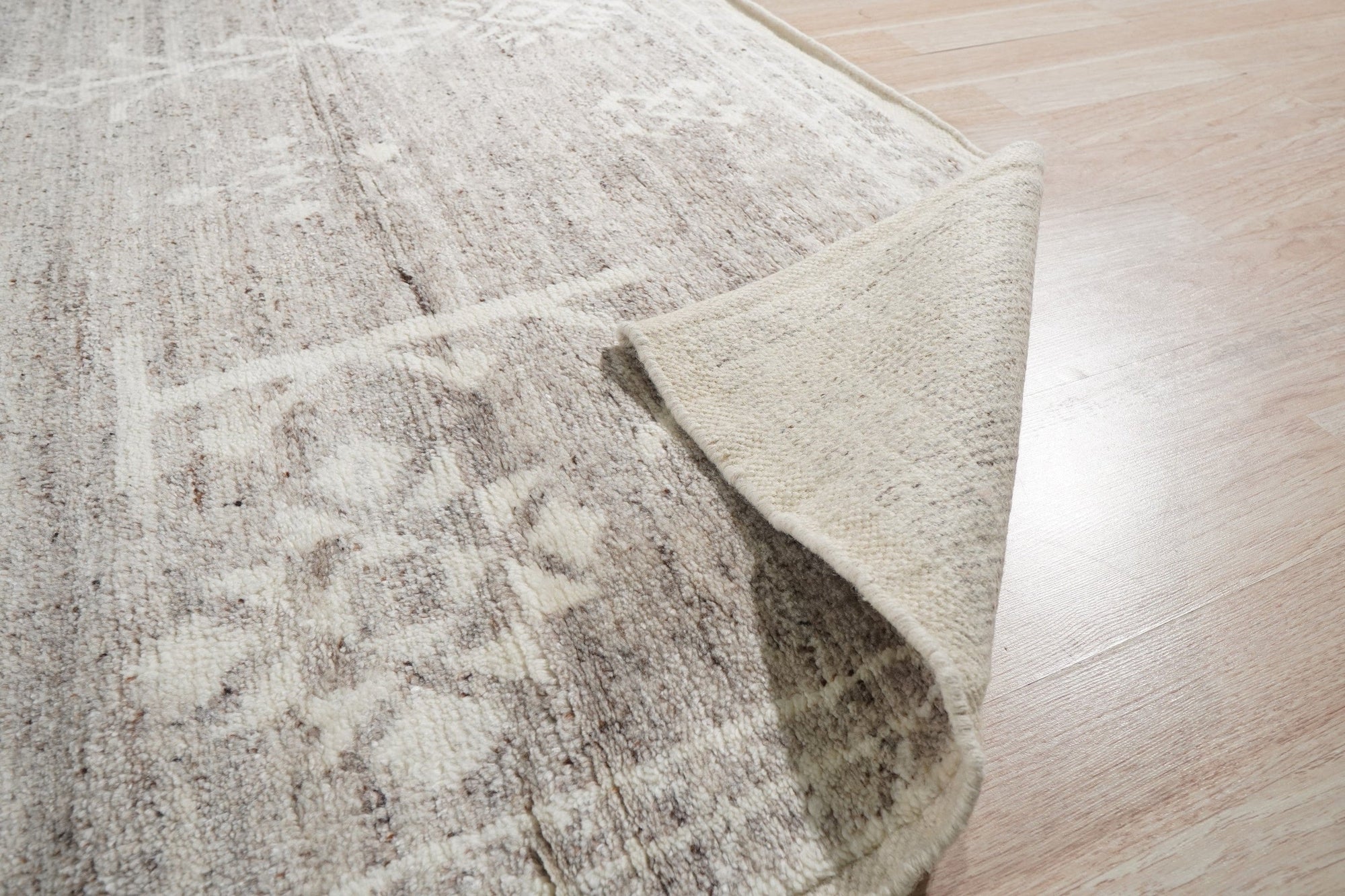 Celia Oushak Gray Hand Knotted Wool Rug, its plush gray wool pile and intricate Oushak design softening a contemporary living space.