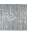 Celia Oushak Gray Hand Knotted Wool Rug, its intricate Oushak design gracing a light-filled room, subtle gray tones softening the traditional patterns.