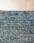 Jade Elegant Blue Hand Knotted Silk Rug, showcasing intricate details and rich blues in a close-up view, highlighting its luxurious silk construction.