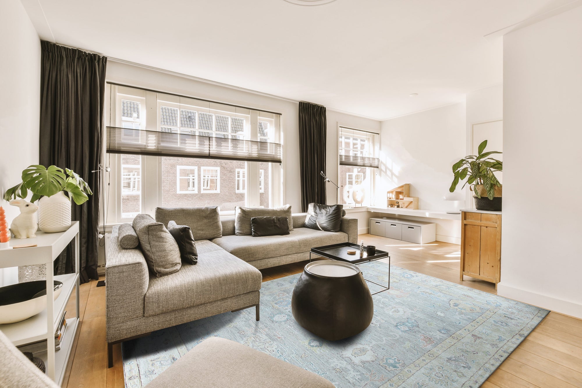 Exquisite Celia Beige Hand Knotted Silk Rug, shimmering with subtle sheen, features intricate floral patterns woven into a soft beige field. The hand-knotted silk construction creates a luxurious texture and delicate detail, visible in a detailed close-up.