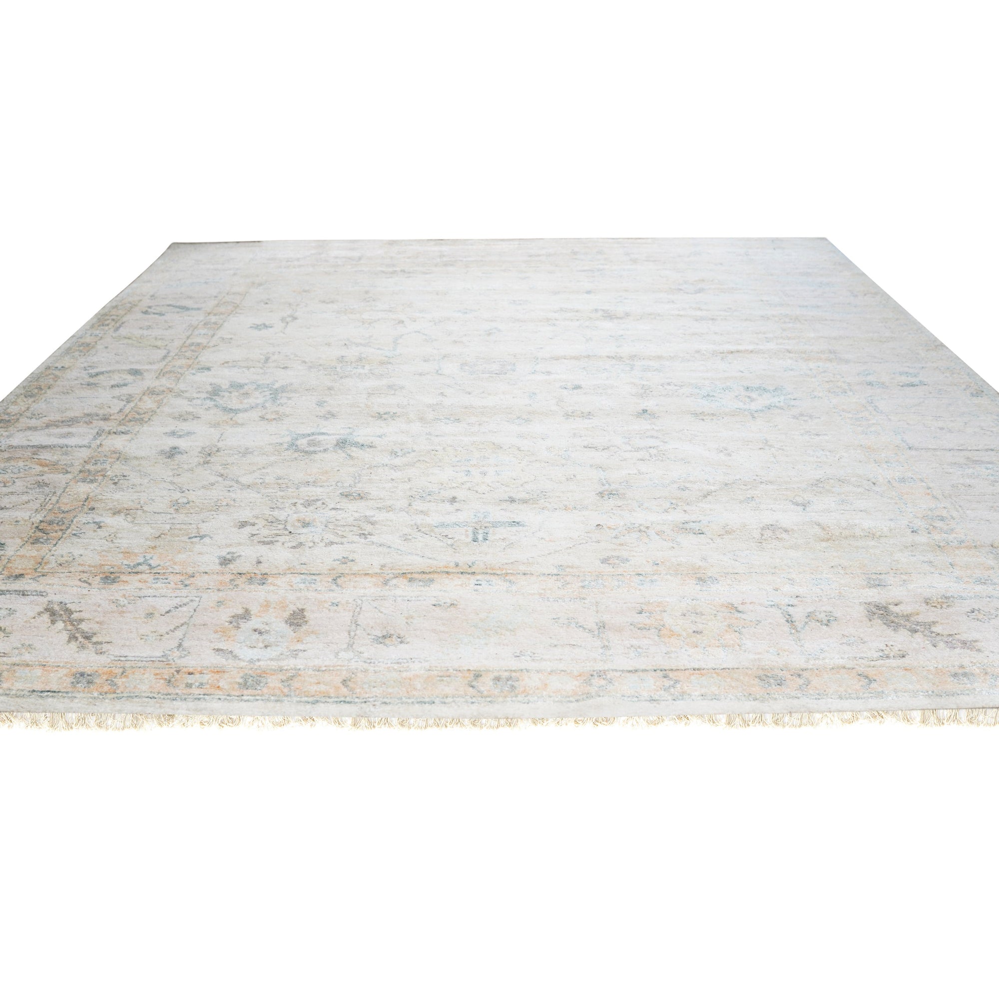 Elena Para Ivory Hand Knotted Silk Rug, showcasing intricate detailing and subtle texture, displayed in a well-lit interior.