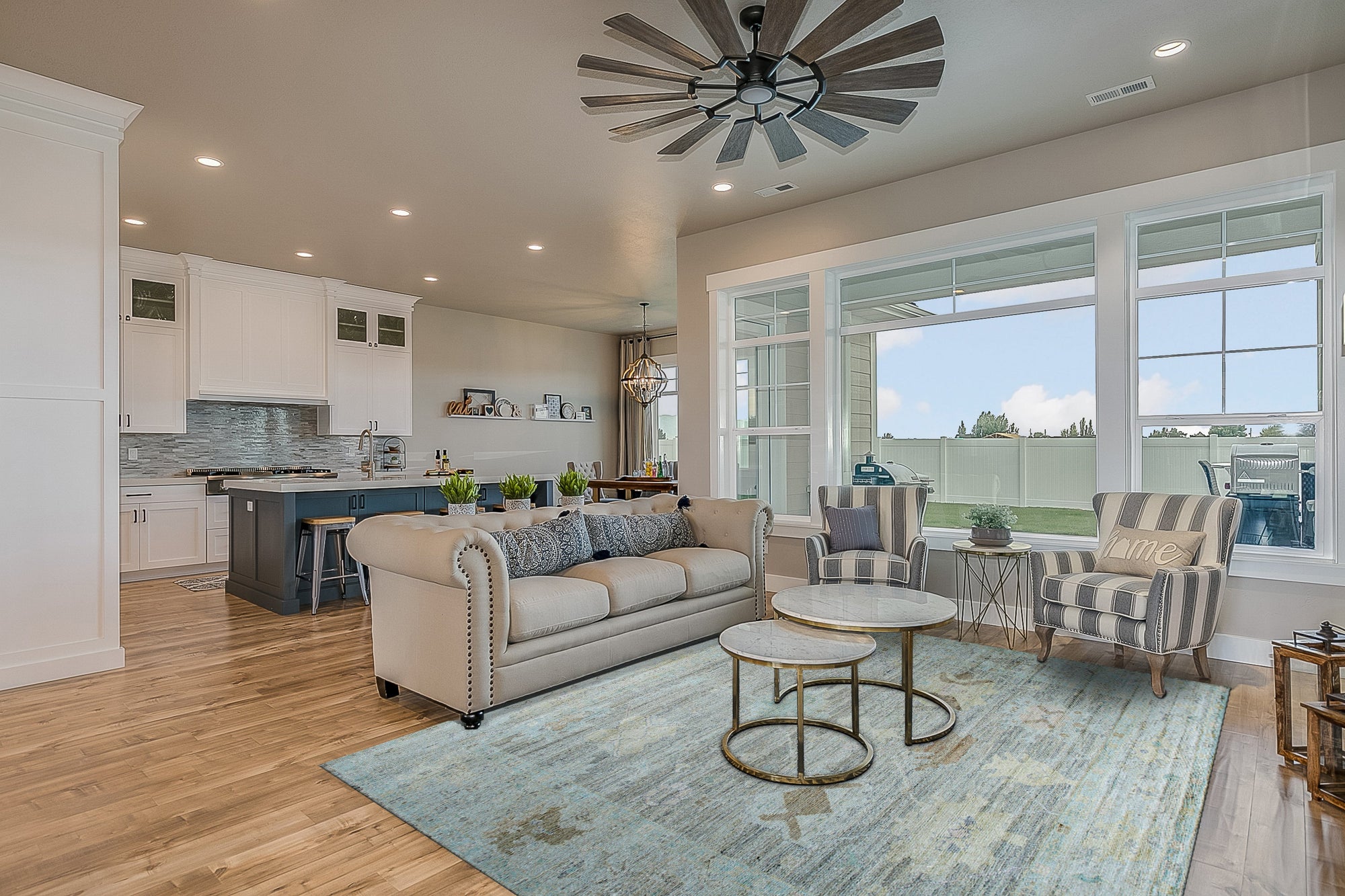 Ruby Fiona Ivory Hand Knotted Silk Rug, showcasing intricate hand-knotted detailing and a luminous ivory hue, softly illuminates a warmly lit living space.