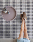Radiant Tessa Blue Handmade Bamboo Silk Rug, its shimmering blue silk catching light in a subtly patterned texture, laying within a well-lit interior space.