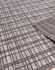 Versatile Ella Silver Handmade Bamboo Silk Rug, its cool silver tones shimmering with subtle texture, lending a sophisticated, luxurious touch to an unseen room.