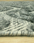 Charming Para Green Handmade Wool Rug, displaying a textured weave and subtle variations of para green, partially visible in a bright interior setting.
