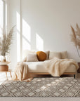 Elena Captivating Beige Hand Knotted Wool Rug, displayed in a brightly lit room, showcasing its subtle beige tones and hand-knotted texture.