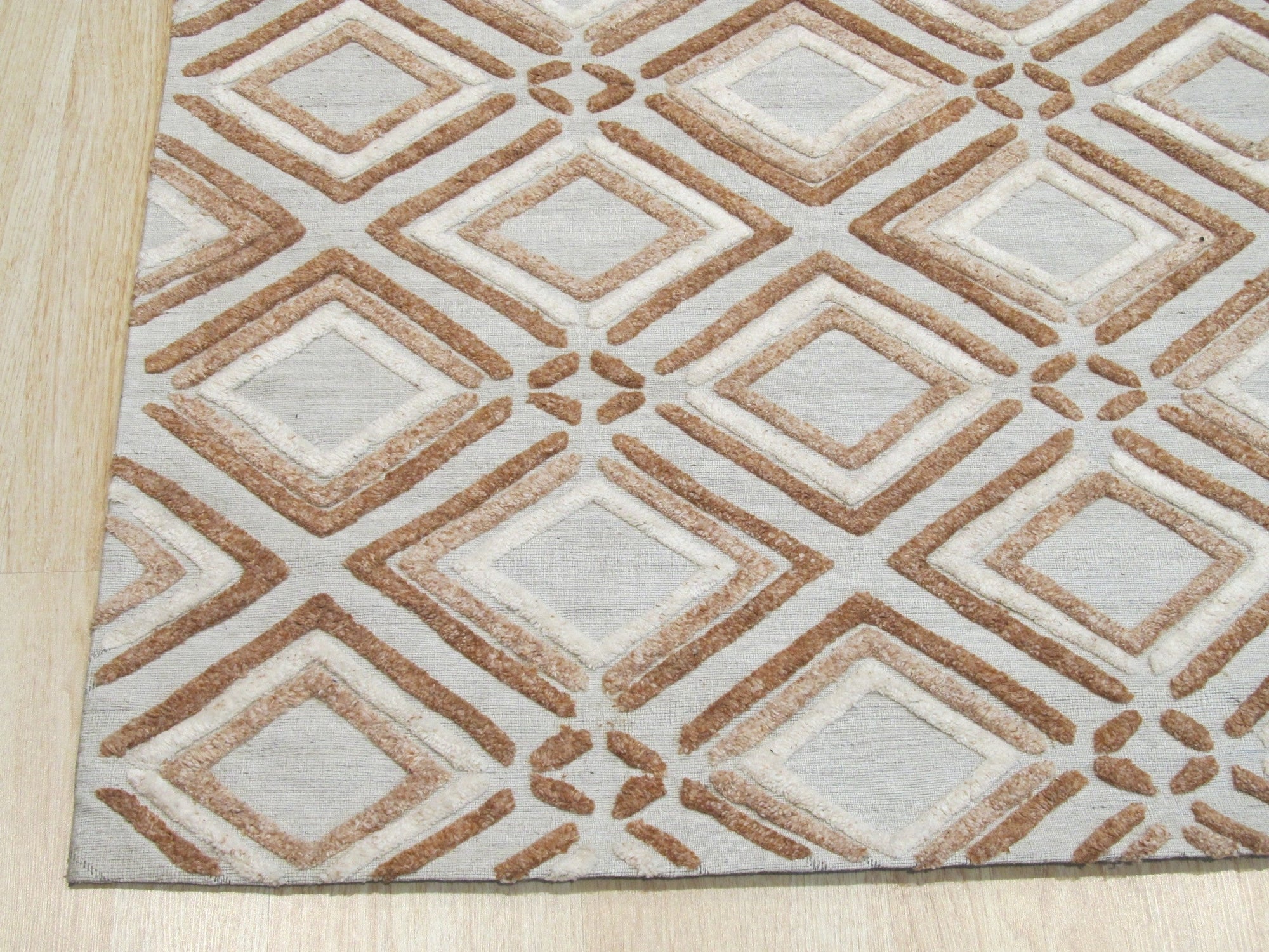 Sumptuous Diamond Brown Hand Knotted Wool Rug, rich brown wool with a prominent diamond pattern, displayed in a warm living room setting.