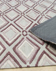 Isla Diamond Purple Hand Knotted Wool Rug displayed with woven texture and diamond pattern detail; plush pile and rich purple hues are prominent in this close-up view.