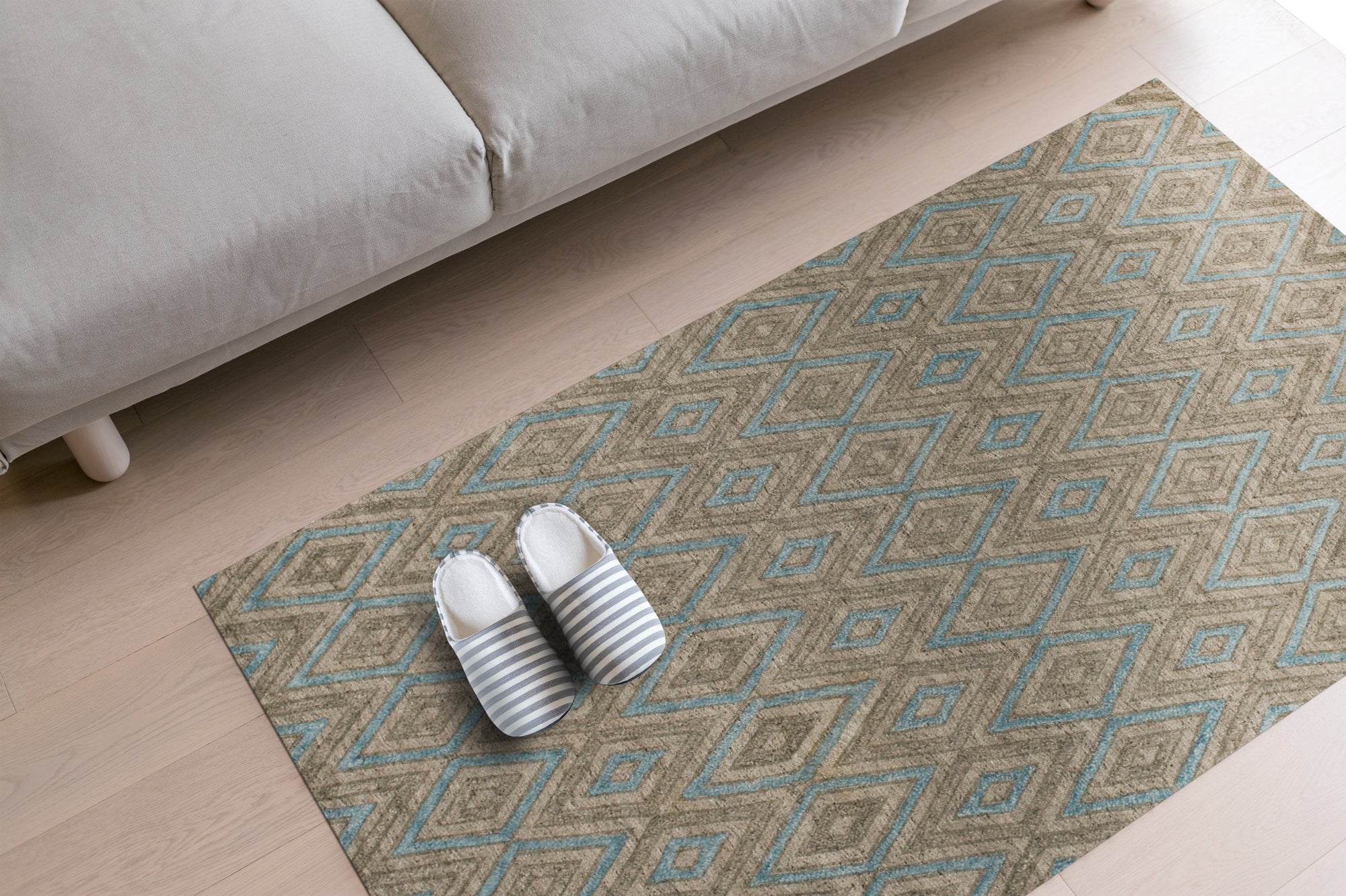 Timeless Trellis Gray Hand Knotted Wool & Viscose Rug, gray wool and viscose rug featuring a classic trellis pattern, displayed in a living room setting with a sofa and coffee table.