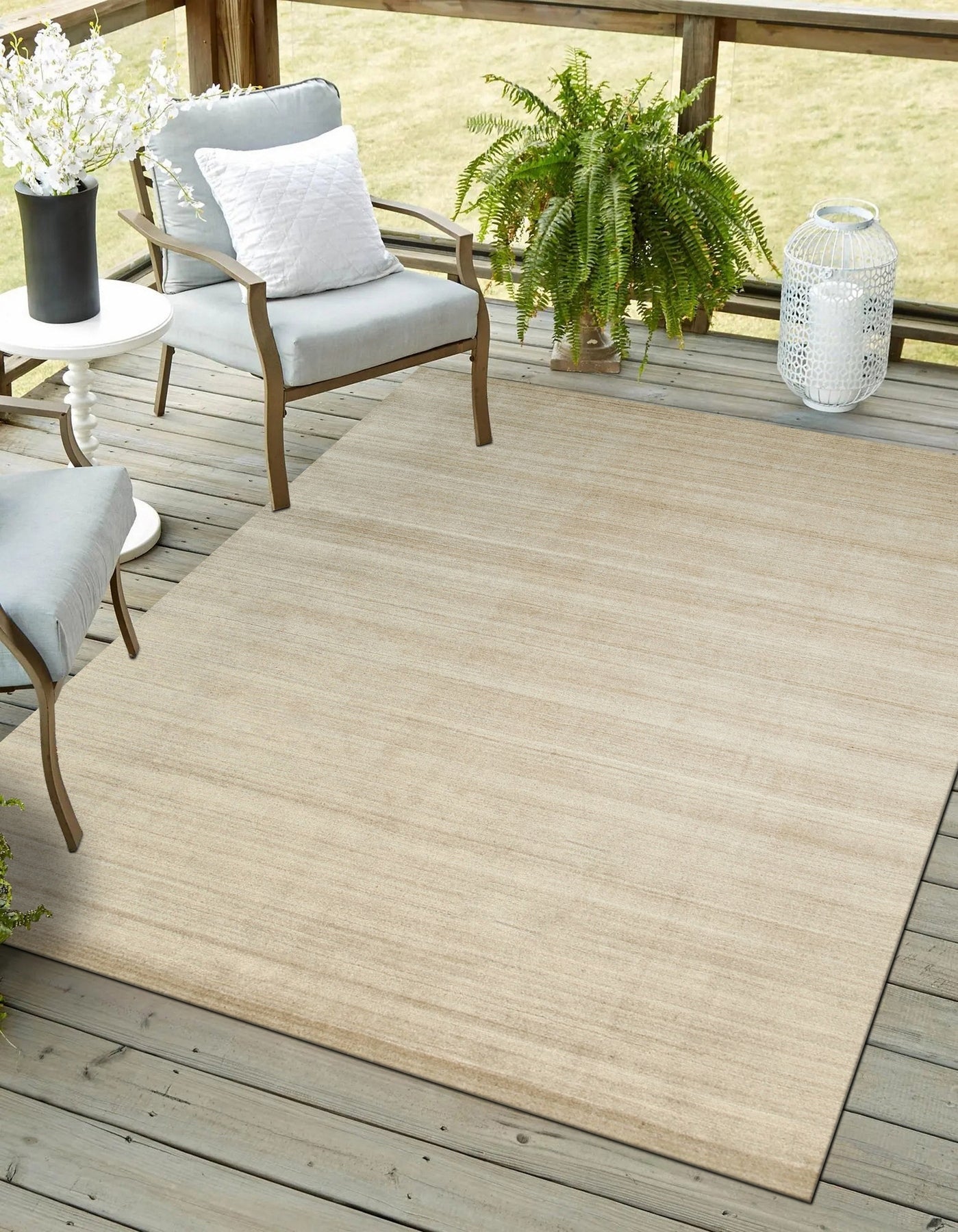 Elena Rhea Gold Handmade Wool & Viscose Rug, boasting shimmering gold accents and a subtle sheen from its viscose fibers, draped elegantly in a room setting.