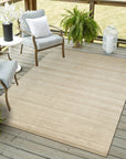 Elena Rhea Gold Handmade Wool & Viscose Rug, boasting shimmering gold accents and a subtle sheen from its viscose fibers, draped elegantly in a room setting.