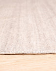 Maya Unique Beige Handmade Wool & Viscose Rug, its soft beige tones and subtle sheen adding warmth to a modern living space, showcasing the blend of wool and viscose fibers.