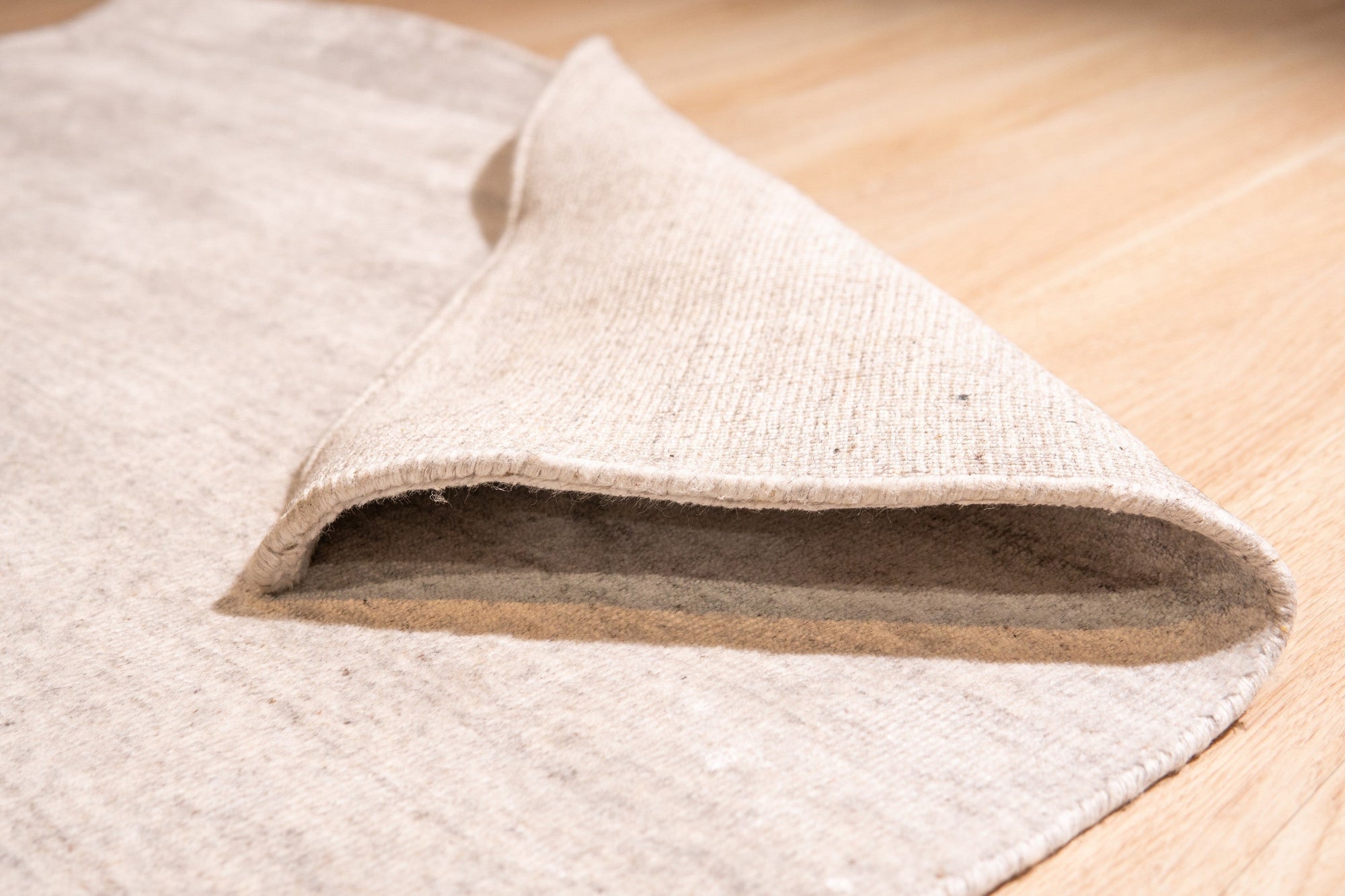 Maya Unique Beige Handmade Wool & Viscose Rug, showcasing subtle textures and a soft, neutral beige palette in a stylish living space.