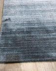 Refined Majestic Silver Handmade Wool & Viscose Rug, shimmering silver and cream tones coalesce in this luxurious wool and viscose rug, its intricate design adding elegance to a sophisticated setting.