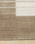 Rhea Quinn Brown Handmade Wool & Viscose Rug, blending warm brown tones and subtle textures, displayed in a cozy living room setting with contemporary furniture, highlighting its soft sheen and handcrafted quality.