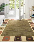 Luna Gabbeh Green Nan Rug, a lush green rug with a textured, hand-knotted Gabbeh weave, offering a comforting and inviting presence in a softly lit room.