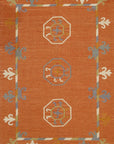 Isolated view of Maya Kilim Rust Flatweave Wool Rug, showcasing its intricate geometric pattern in warm rust tones and traditional flatweave construction.