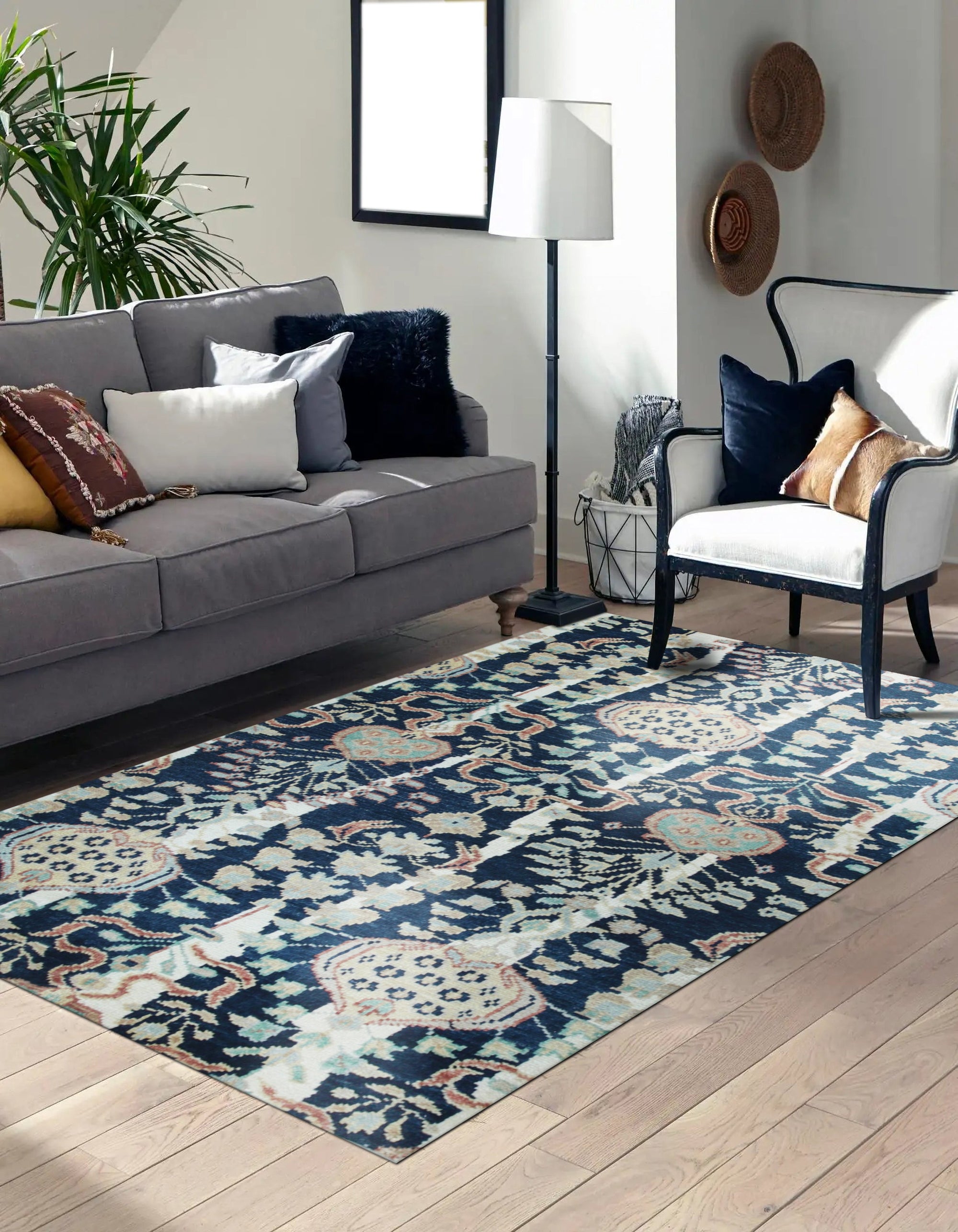 Zinnia Louie Blue Hand Knotted Wool Rug, showcasing its intricate blue-toned floral pattern and dense wool pile in a staged room setting.