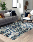 Zinnia Louie Blue Hand Knotted Wool Rug, showcasing its intricate blue-toned floral pattern and dense wool pile in a staged room setting.